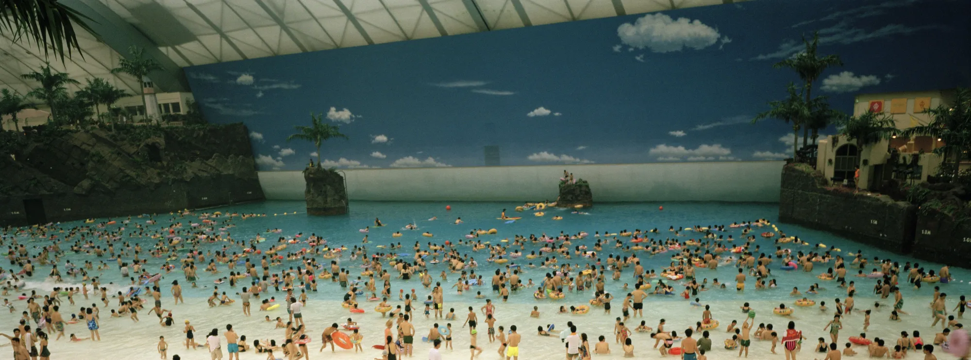 Martin Parr, Japan. Miyazaki. The Artificial beach inside the Ocean Dome. From 'Small World'. 1996, Magnum Photos